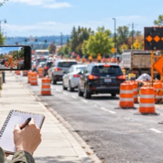 Commuter safely documents a roadwork detour and traffic disruption with a phone