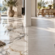 Marble and porcelain tile flooring samples side by side in a sunlit modern living room.