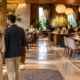 Welcoming restaurant entrance with clear front-of-house circulation, seating, and reception lighting.