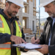 Contractor and property owner reviewing a payment waiver at a construction site