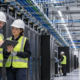 Engineers inspect server racks, power, cooling, and cable systems in a mission-critical data center.
