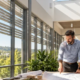 Architects discuss daylighting in a commercial interior with high windows, skylights, and exterior sun shades.