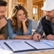 Homebuyer, lender and builder review construction loan eligibility, budget and draw schedule at a homebuilding site