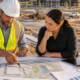 A developer, engineer, and estimator review site plans and infrastructure costs for a new commercial development.