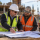 A general contractor risk manager reviews a CCIP cost schedule and subcontractor enrollment records with trade foremen at a large building project.