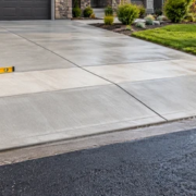 Concrete driveway apron forms a smooth transition from the private driveway to the street