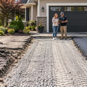 Cracked driveway is removed, the base is prepared and a new asphalt surface is compacted