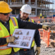 Construction crew reviewing a job safety analysis and task controls before work