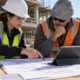 Construction project engineer reviewing technical documents and coordinating field work