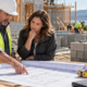 Construction contractor explaining labor, equipment and material cost drivers to a client
