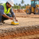 Site engineer tests a compacted construction fill layer to check material suitability and moisture