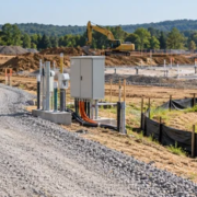 Construction site access road, temporary utility connections, and sediment controls supporting building work