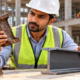 Construction engineer compares corroded iron with structural steel to assess durability and building use