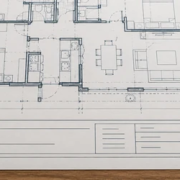 Architectural plan sheet with a clearly divided title block for project details, drawing number, scale, date, designer, and revision tracking.