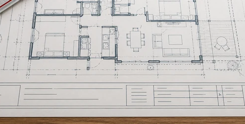 Architectural plan sheet with a clearly divided title block for project details, drawing number, scale, date, designer, and revision tracking.