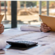 Contractors review proposal folders and construction plans during a commercial pre-bid meeting.