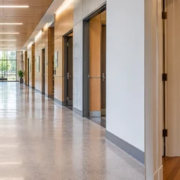 Corridor and hallway access in a building: a long main passage connects multiple rooms, while a shorter hall serves adjacent spaces.