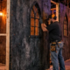 Crew installs braced stud partitions and scenic wall panels inside a seasonal haunted-house attraction, building durable walls for repeated use.