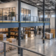 Partial steel mezzanine floor in a warehouse with guarded stair access and open floor space below.