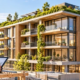 Architect reviews plans beside a sustainable mid-rise building with a green roof, shaded balconies, and timber facade.