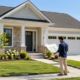 Detached single-family home stands on its own lot as a homeowner reviews the site plan.