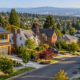 Broad American residential neighborhood with a range of detached single-family homes, showing the scale and variety of the housing stock.