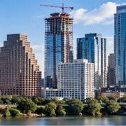 Daylight view of commercial and residential skyscrapers at different heights, illustrating the varied tower forms found in US cities.