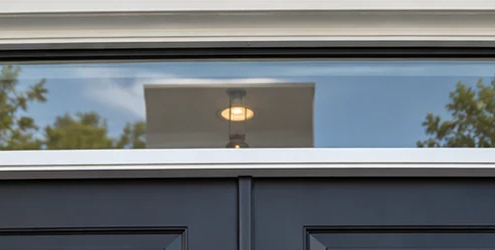A horizontal glazed transom window sits above a door, separated from the opening by a distinct frame and crossbar.