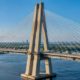 Cable-stayed bridge pylon supporting stay cables and deck over a river